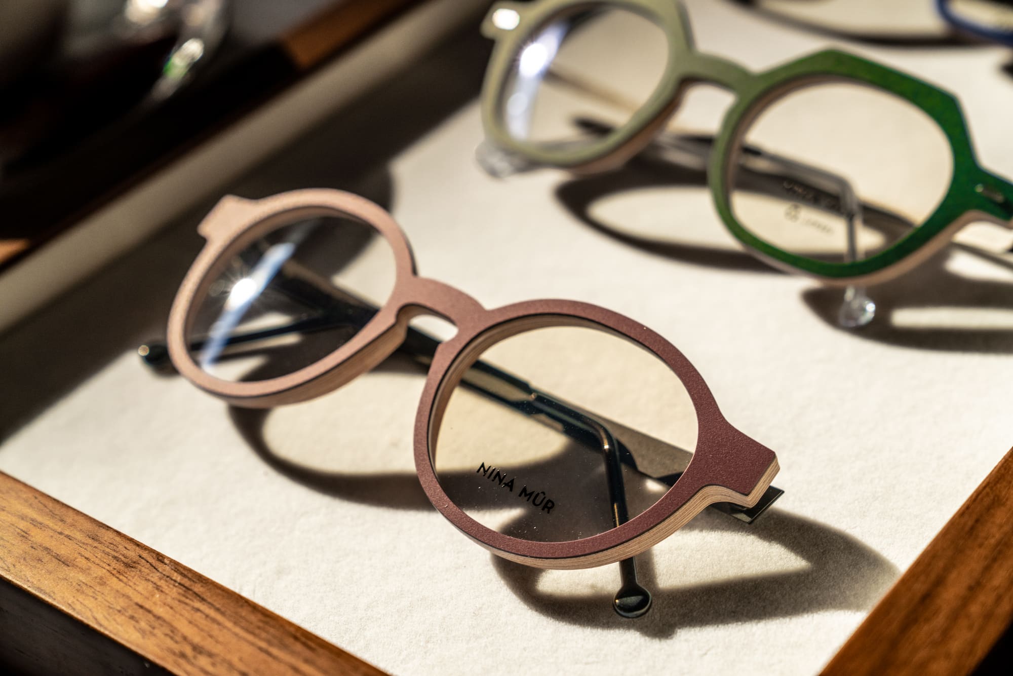 Close-up of designer frames on a display tray
