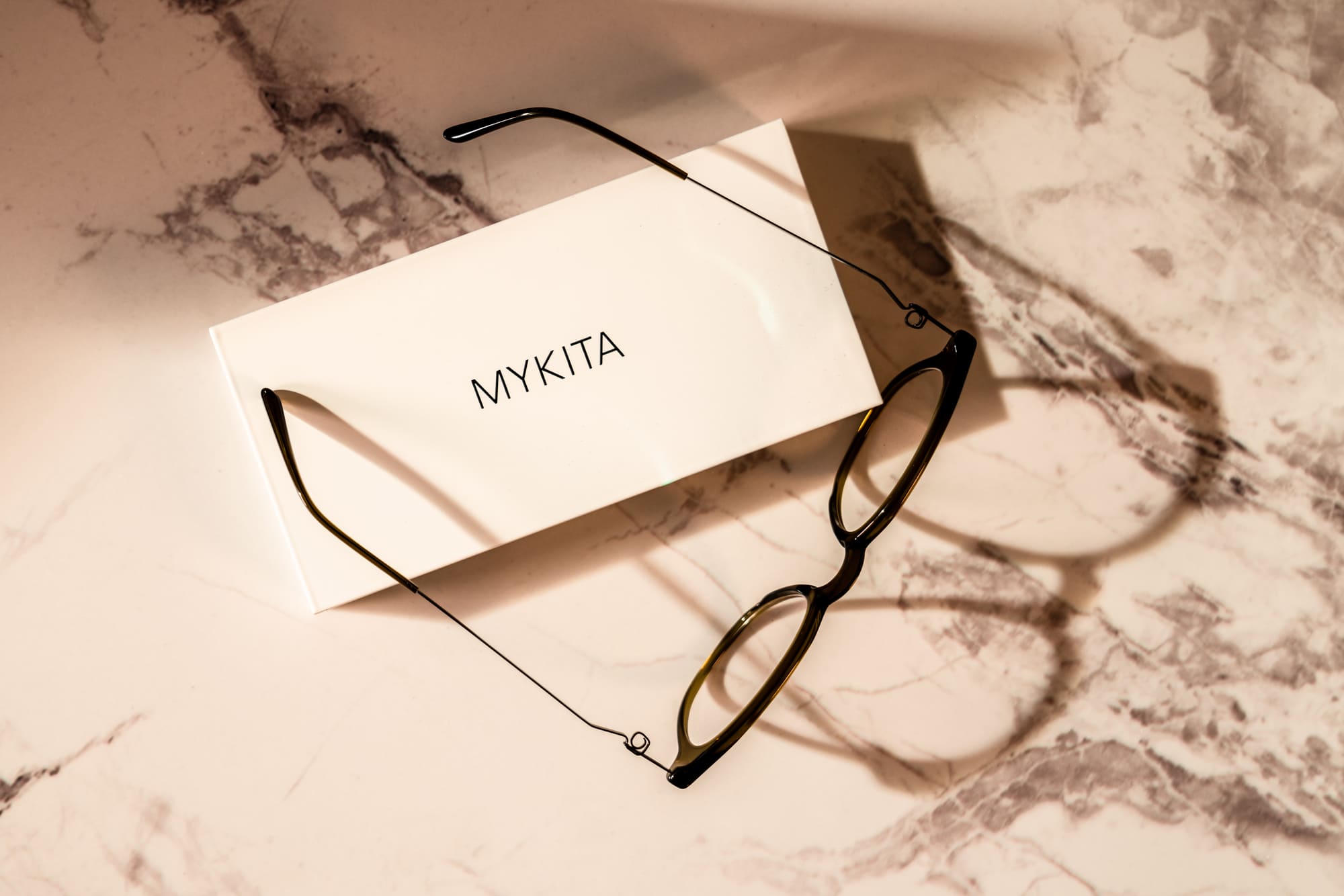 MYKITA frame resting on its case